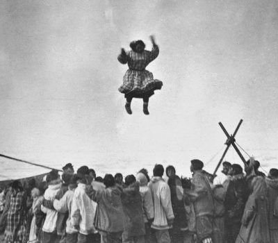 Inuit woman jumping